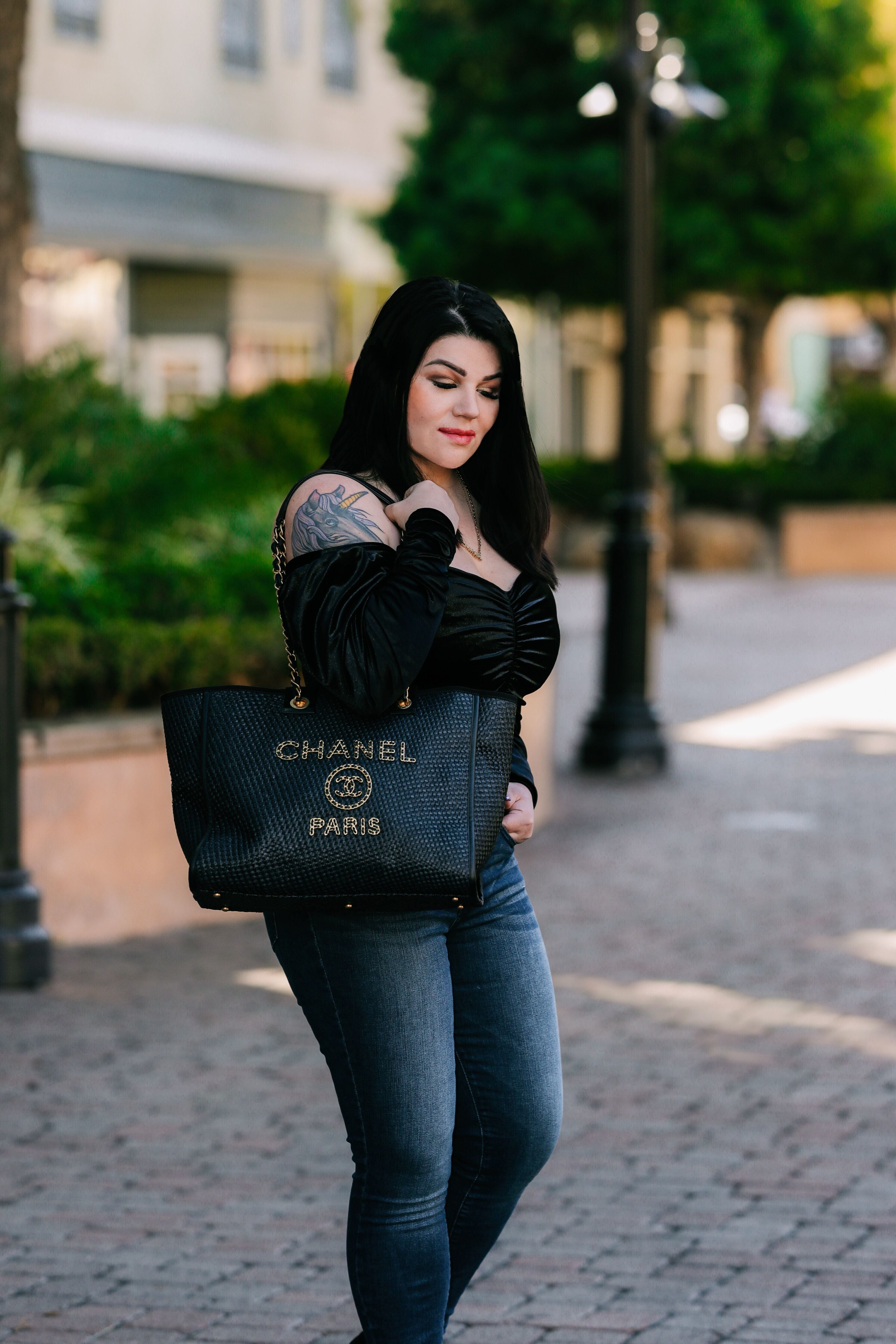 Sasha carrying a Chanel Deauville tote