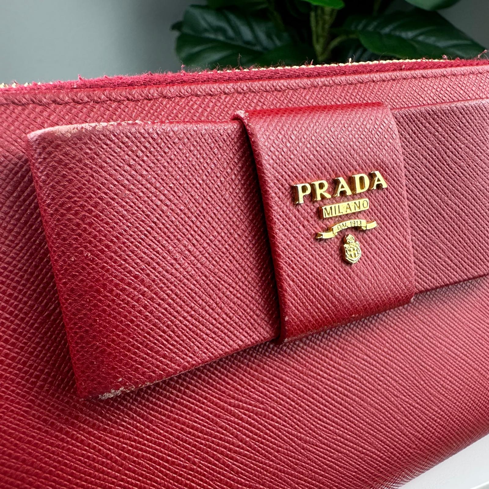 đAuthentic Prada Red Saffiano Leather Bow Zip Wallet