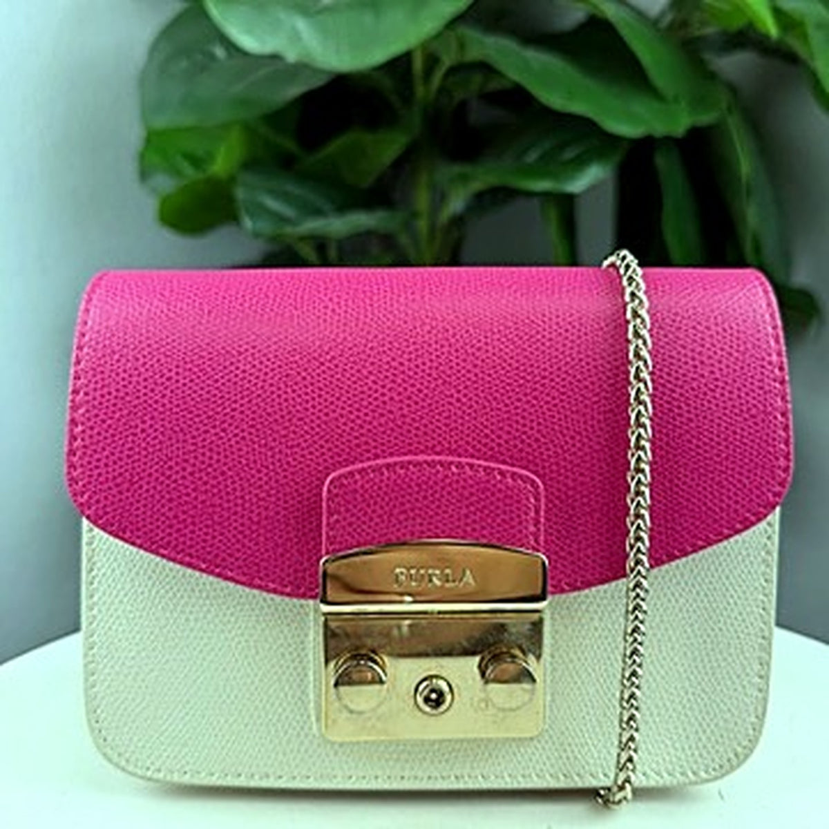 Authentic Furla Metropolis ivory crossbody bag with fuchsia flap attached, front view