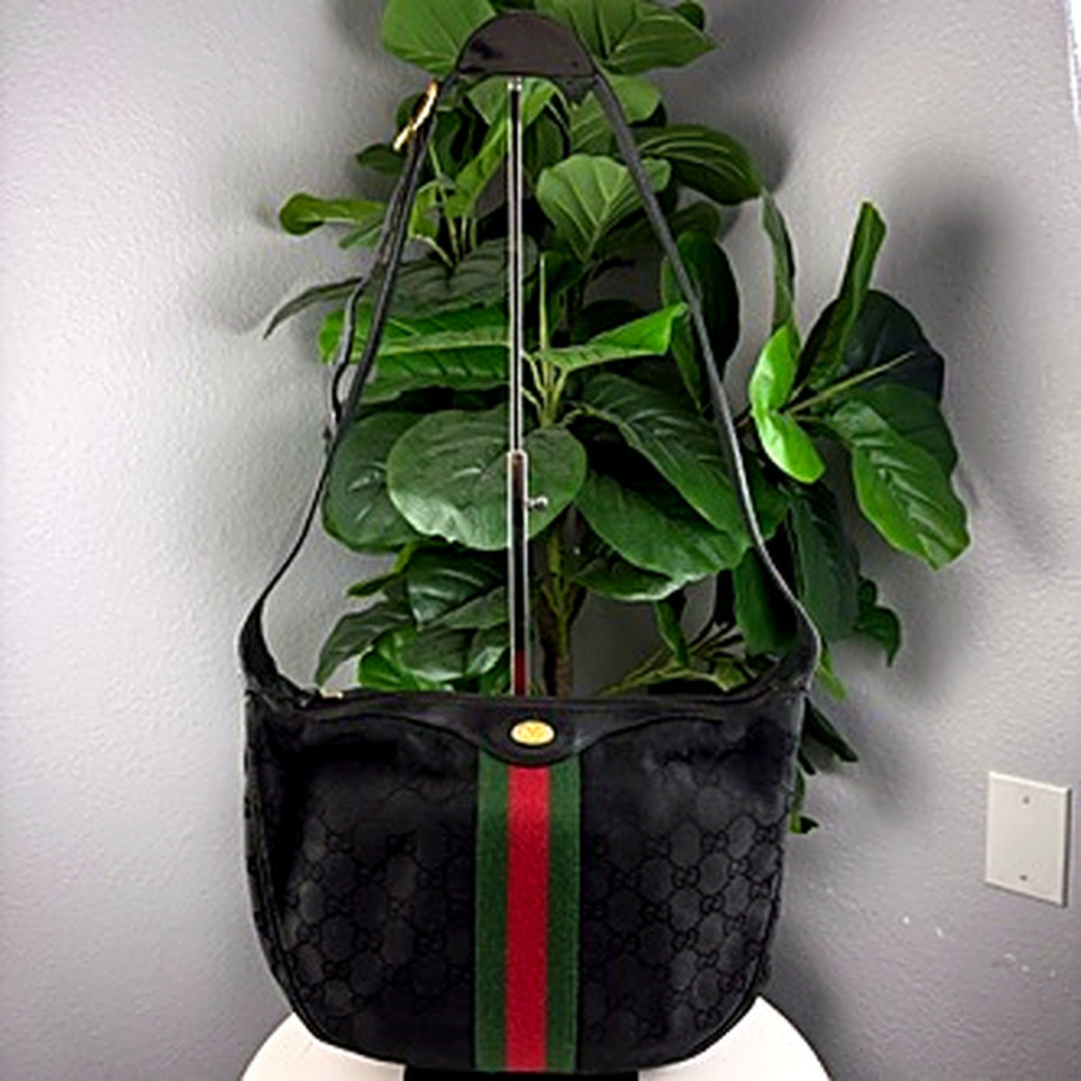 Authentic vintage Gucci Accessory Collection black GG canvas hobo bag - front view with web stripe