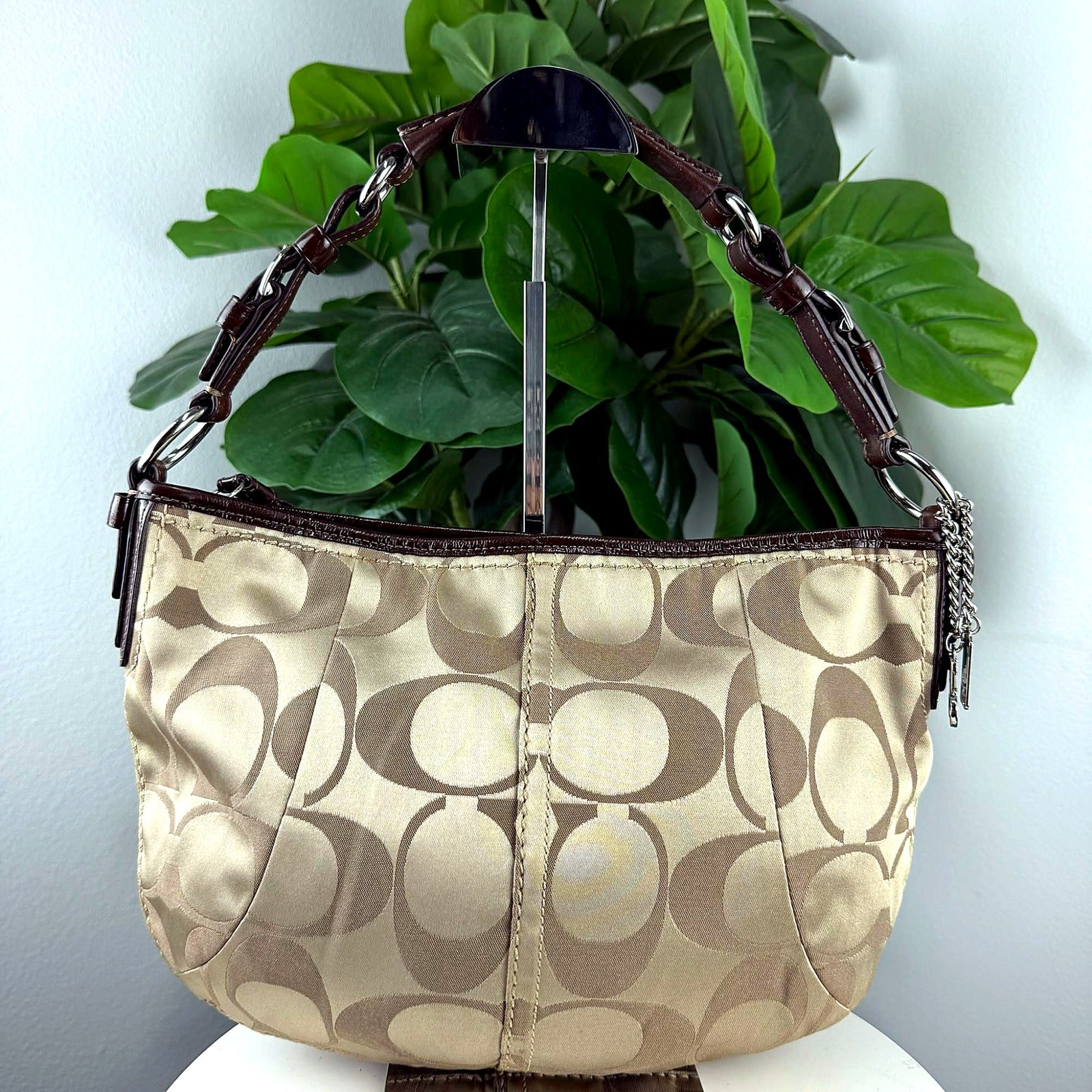 Authentic Coach khaki signature jacquard shoulder bag with charm cluster - front view