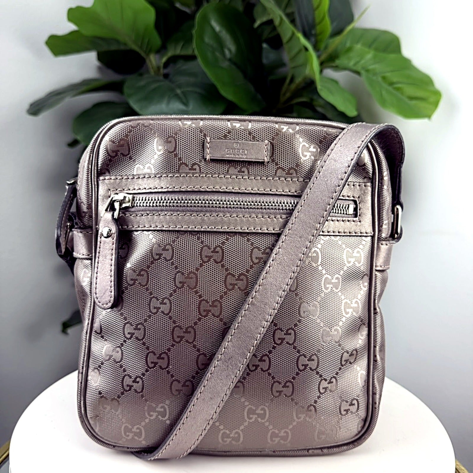 Authentic vintage Gucci GG Monogram canvas messenger bag in pewter - front view with zip pocket and GUCCI made in Italy plate
