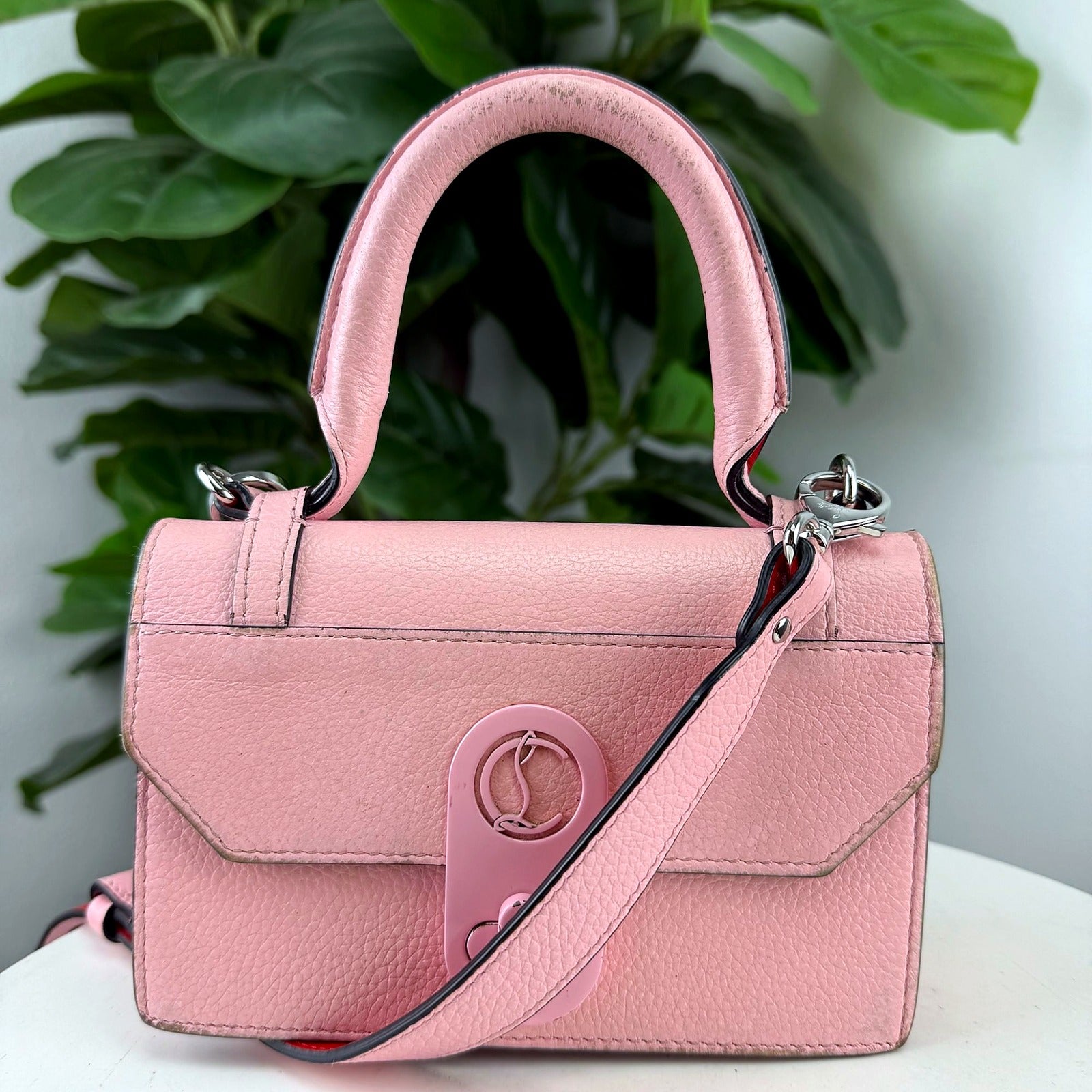Authentic Christian Louboutin pink pebbled leather top handle bag, front view
