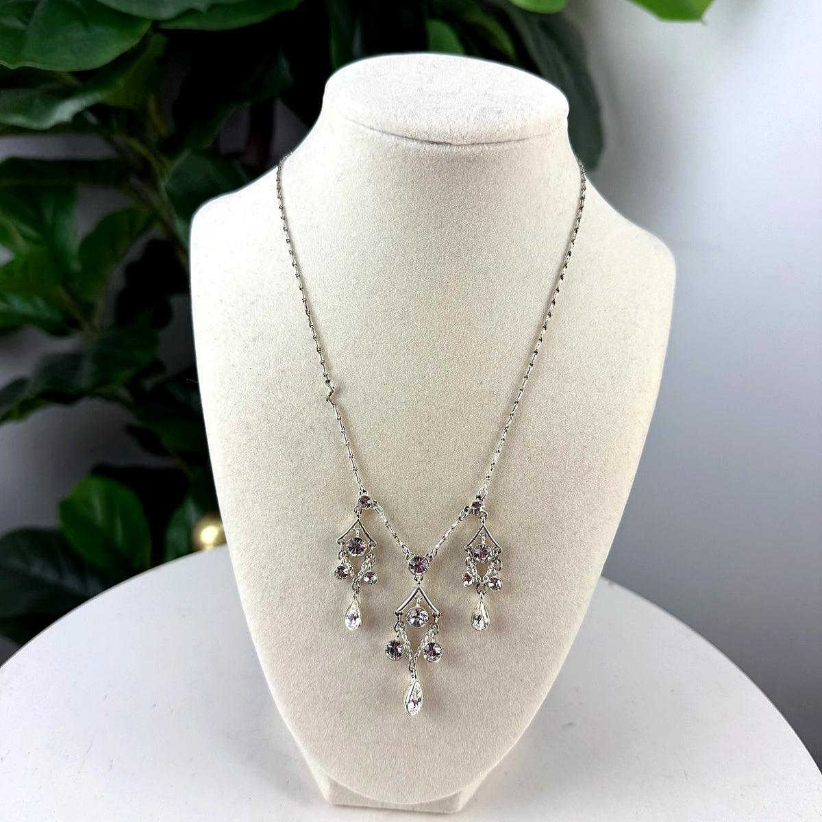 Vintage silver-tone rhinestone chandelier drop necklace on bust form