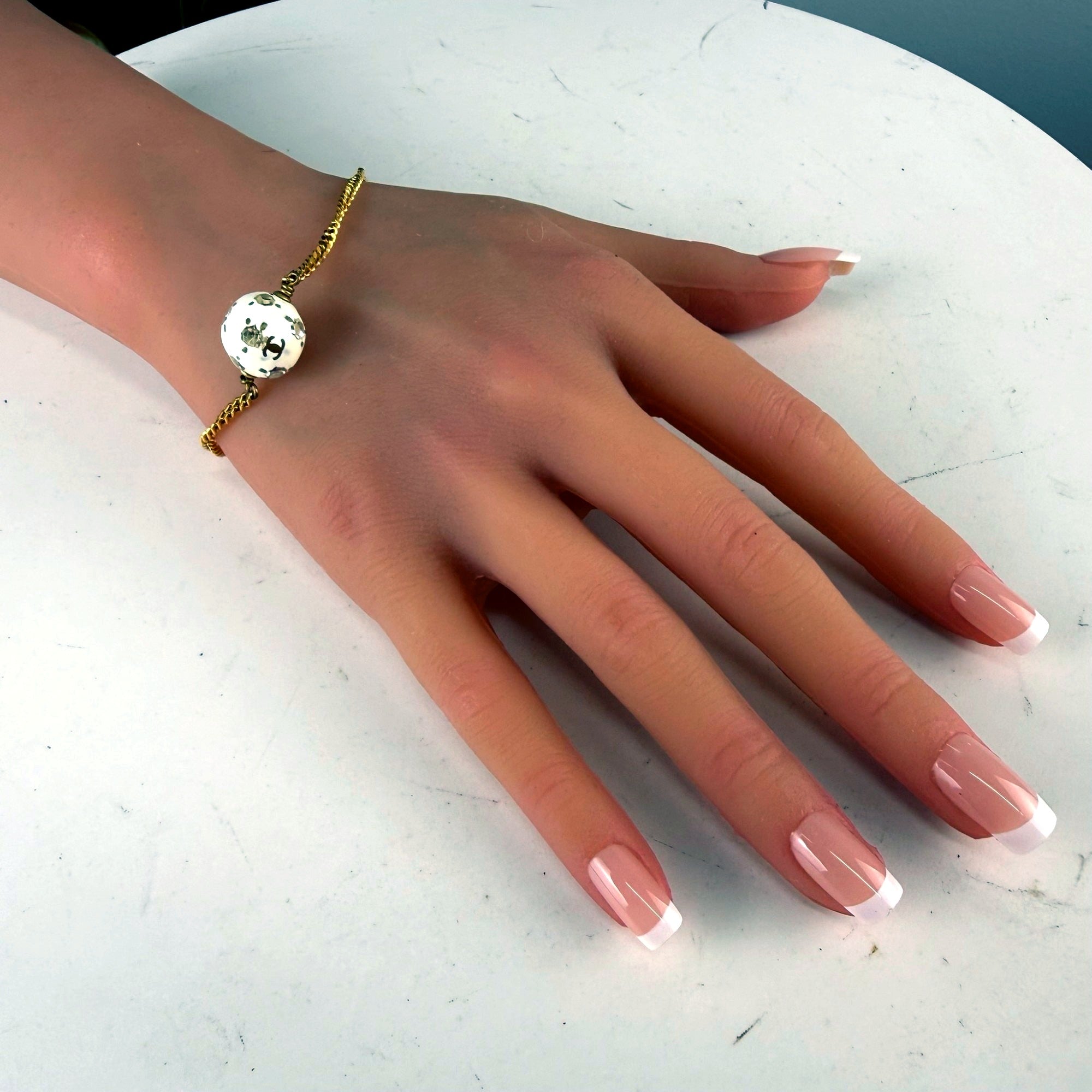 Authentic Chanel Gold-Tone CC Logo Pearl Bead Bracelet - front hero