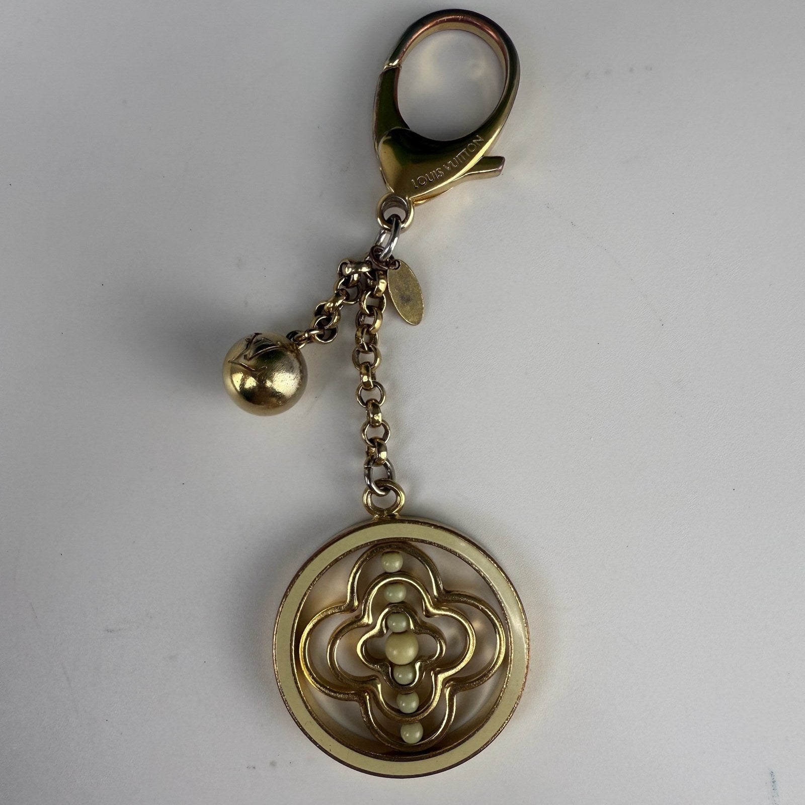 Medallion and ball charm detail