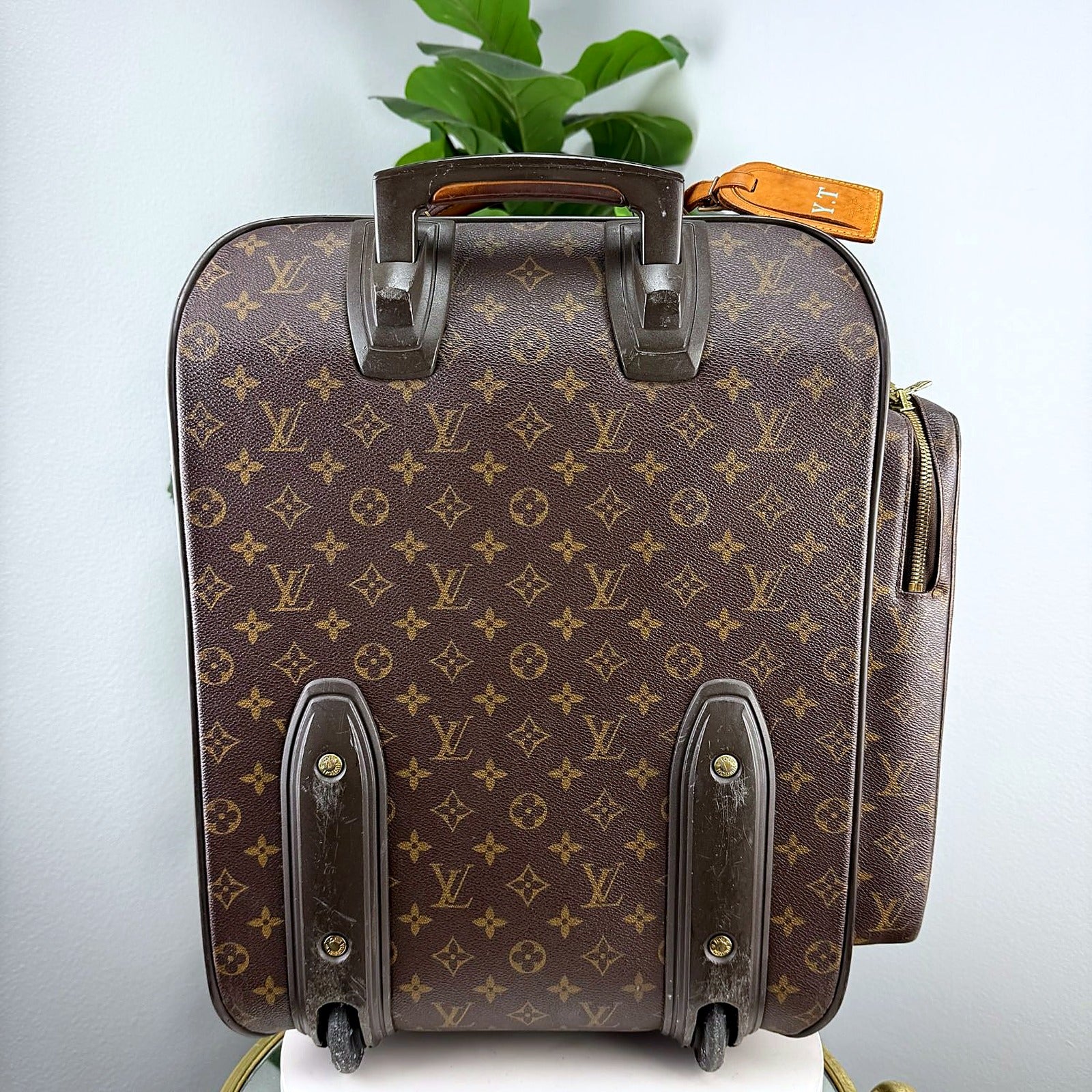 Louis Vuitton Pegase suitcase, back view with wheels and handle