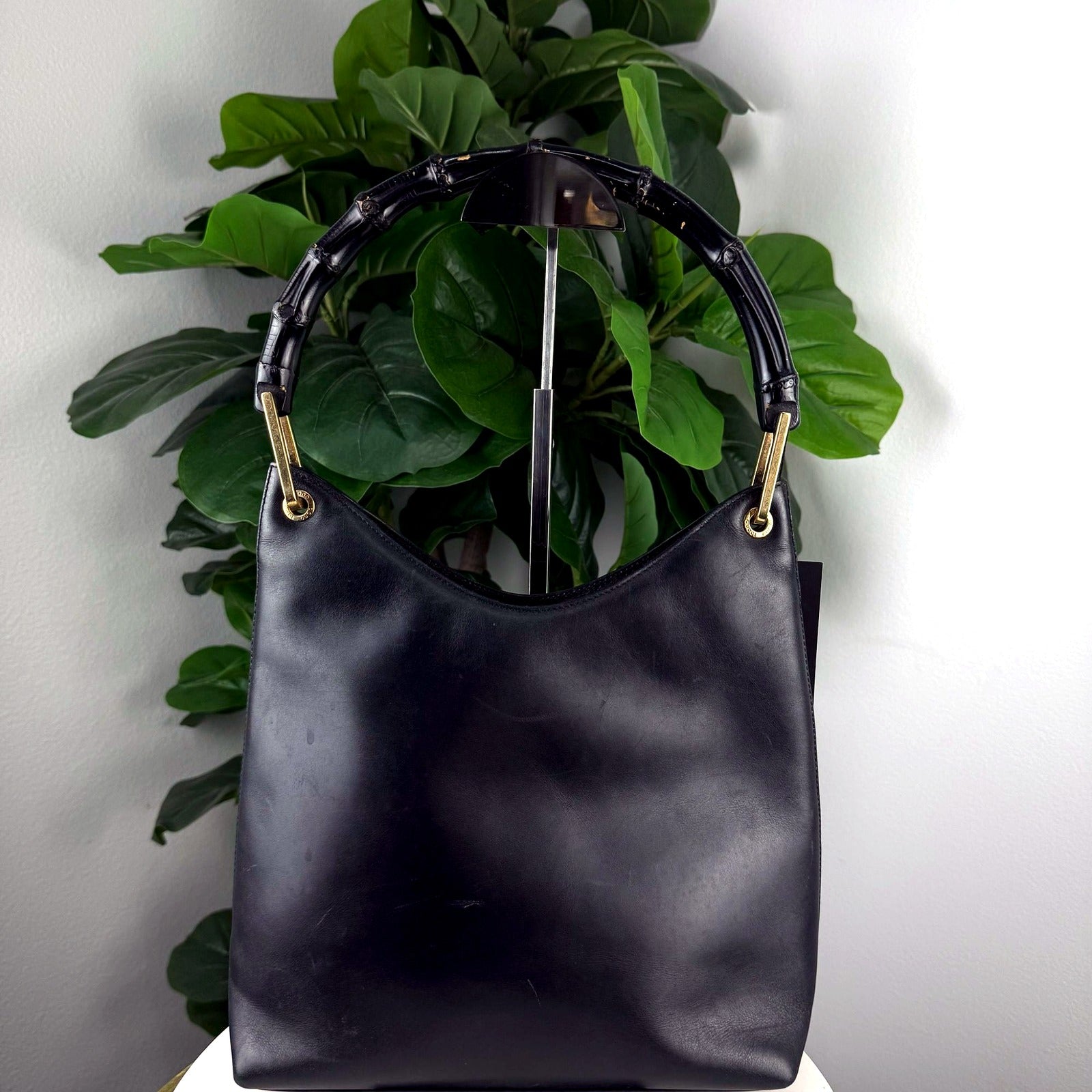 Authentic vintage Gucci black leather bamboo-handle hobo bag, front view