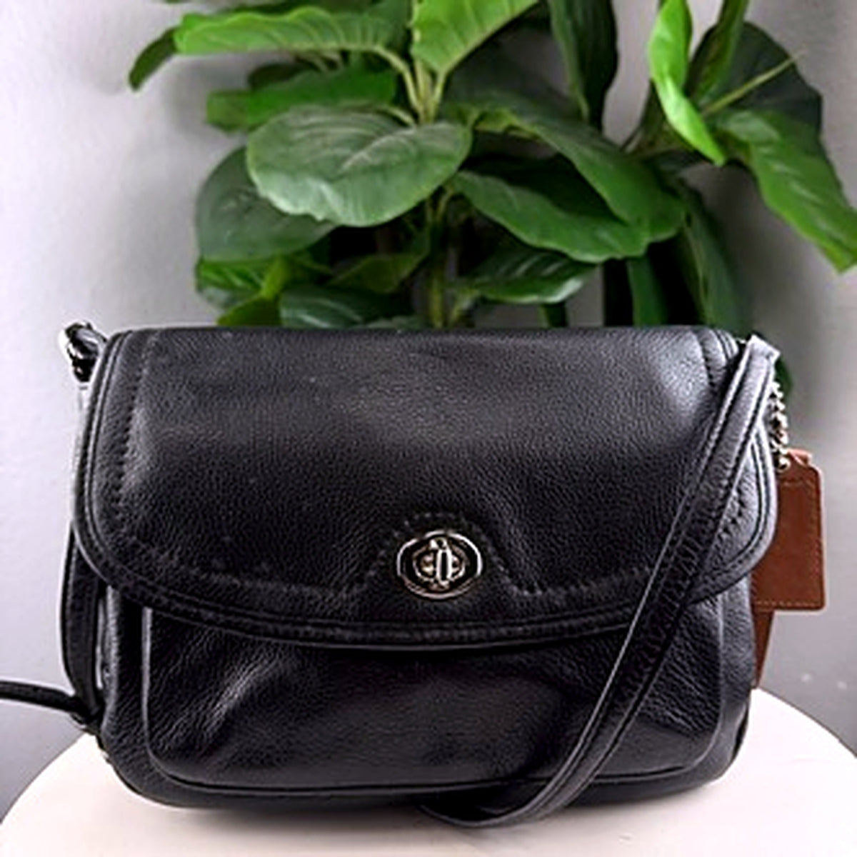 Authentic Coach black pebbled leather turnlock flap crossbody bag, front view