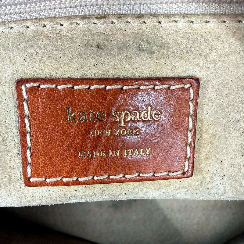 Kate Spade New York Made in Italy interior tag with crack