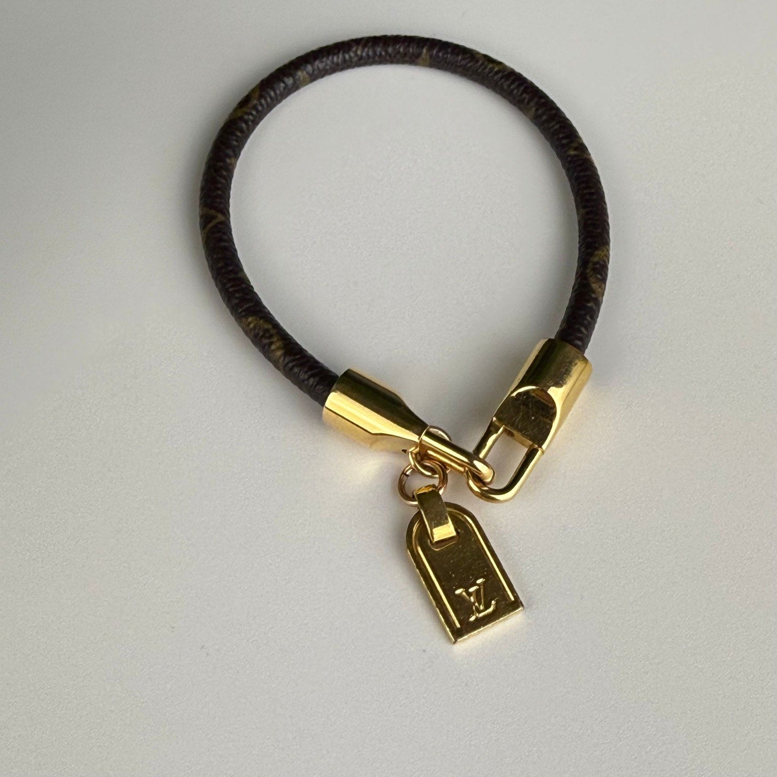 Authentic Louis Vuitton Gold Tone Monogram Canvas Luck It Bracelet 6.5"