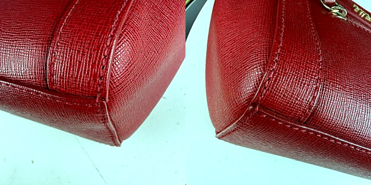 Furla red saffiano crossbody bag corner macro detail showing clean leather texture