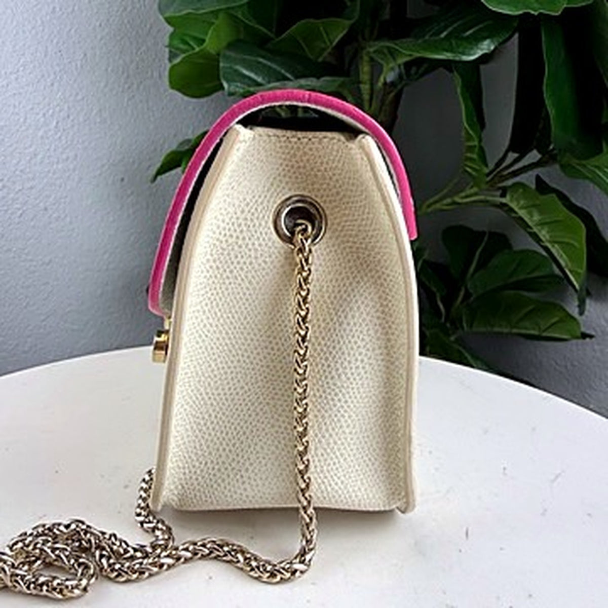 Furla Metropolis bag side view showing gold chain strap