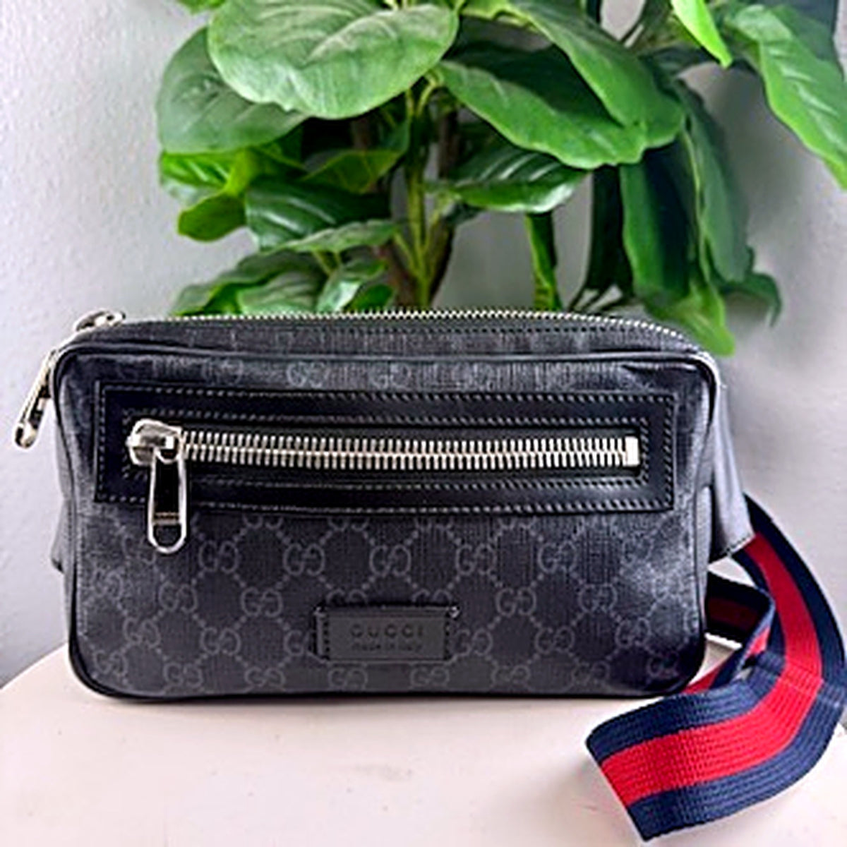 Authentic Gucci GG Supreme black monogram canvas belt bag, front view