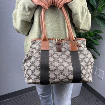 Celine Macadam monogram canvas duffel tote - lifestyle shot worn on shoulder, front view