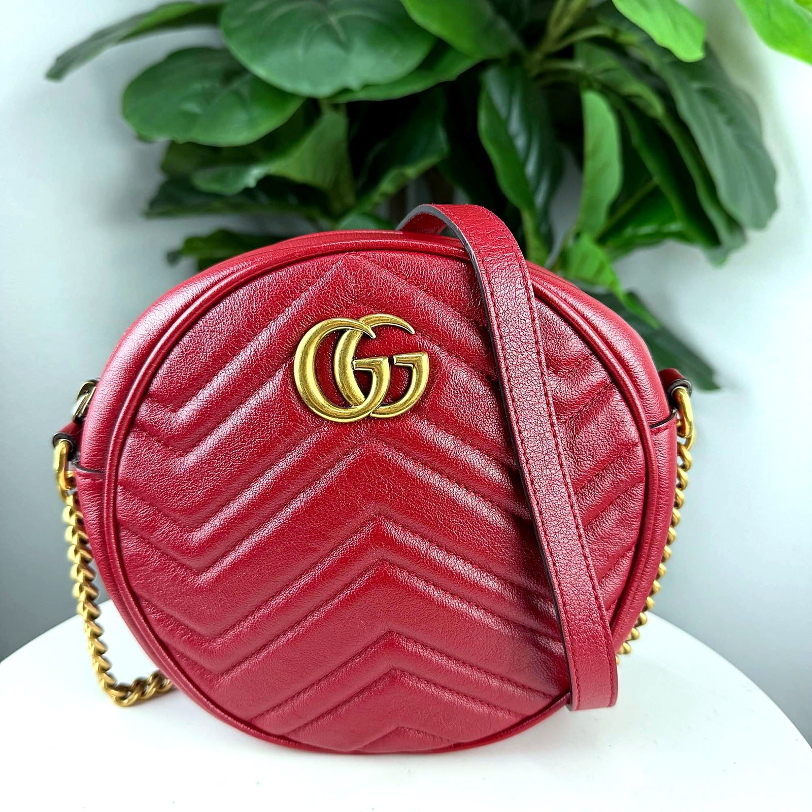 Authentic Gucci GG Marmont red matelasse round mini crossbody bag - front