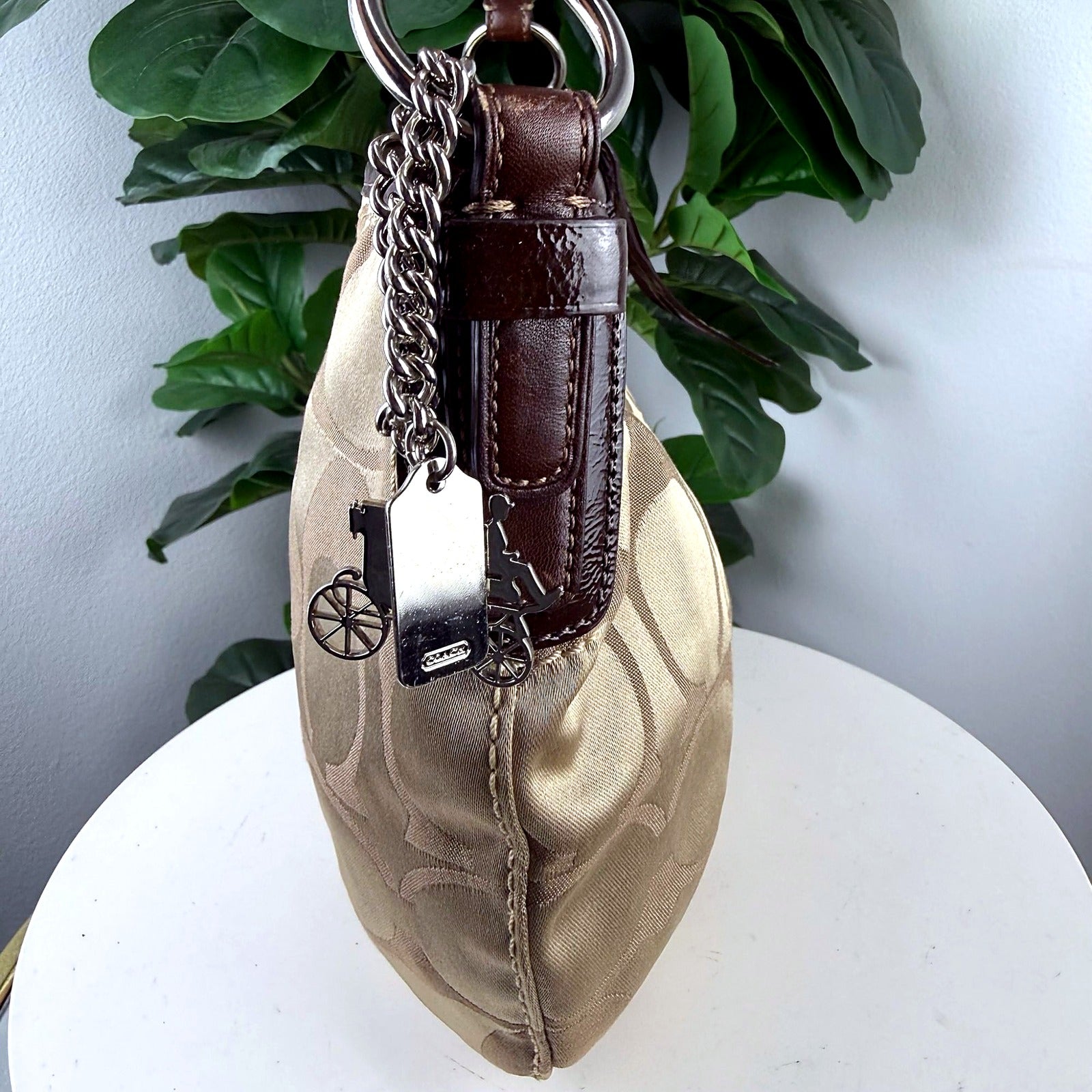 Authentic Coach khaki signature jacquard shoulder bag - charm cluster with horse and carriage, bicycle wheel, and COACH tag charms