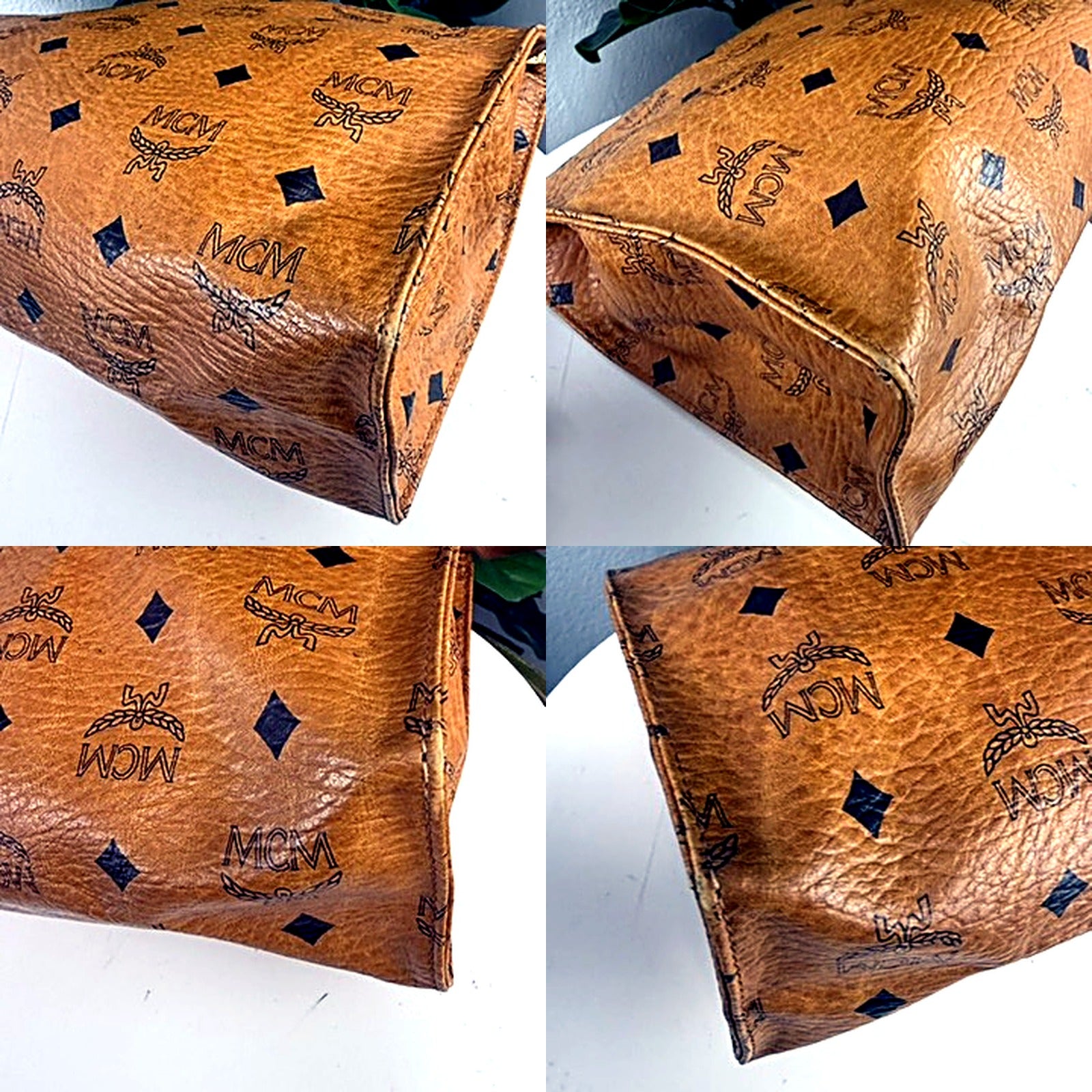Authentic vintage MCM Visetos cognac monogram cosmetic bag clutch - close-up of corner and edge wear and cracking on the coated canvas