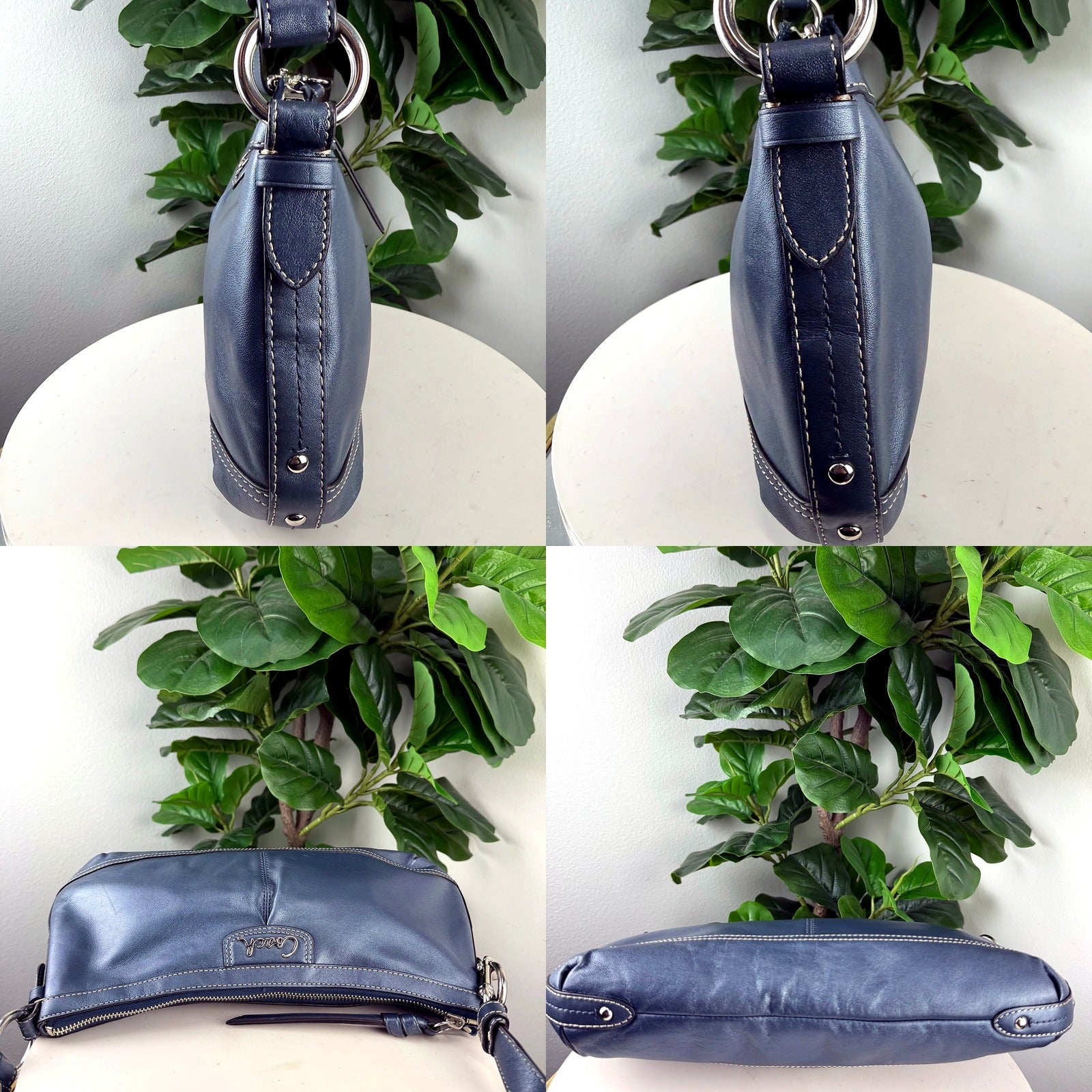 Coach navy shoulder bag hardware detail, D-rings, top zip, tassel, and bottom