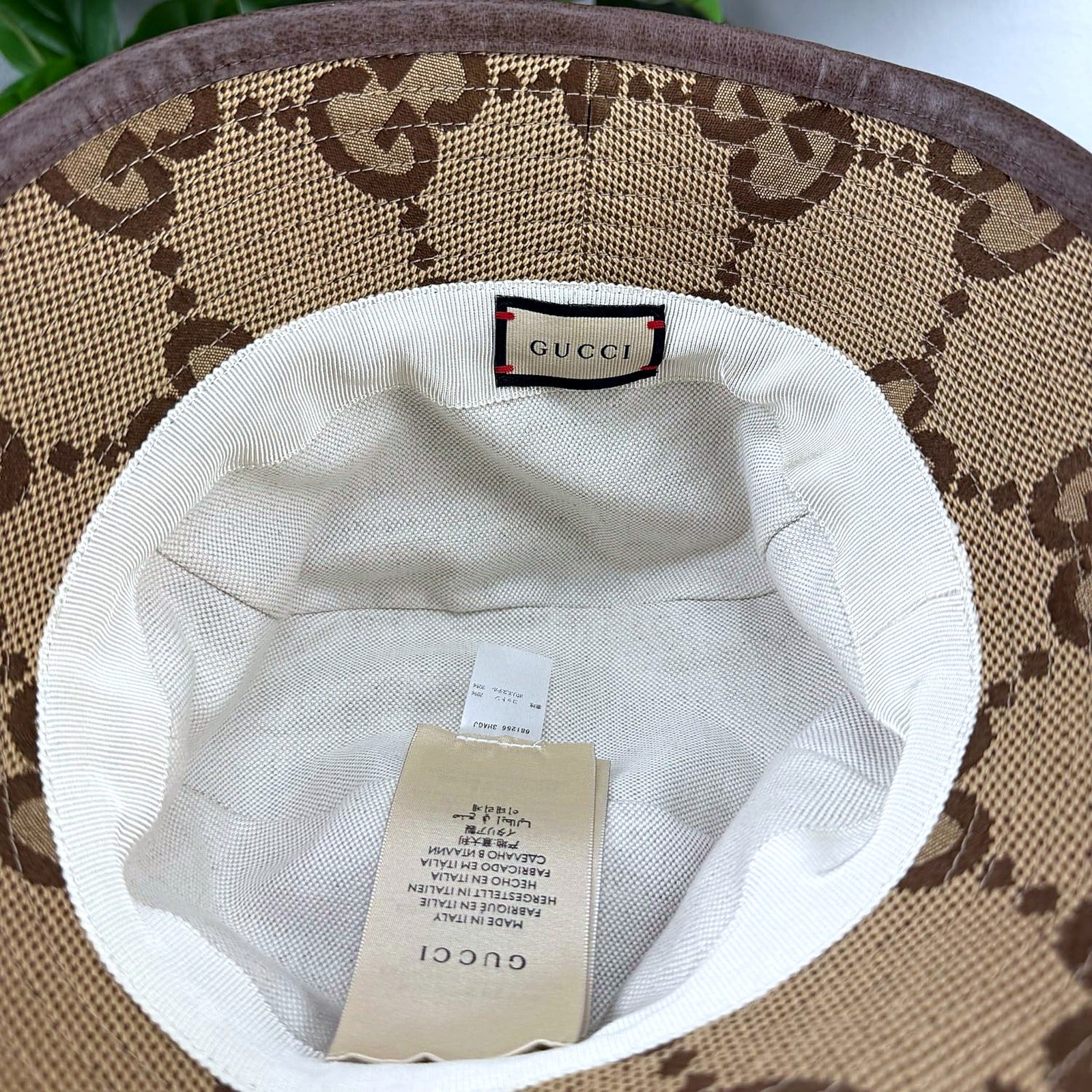 Gucci bucket hat interior with GUCCI woven label and size/care tags