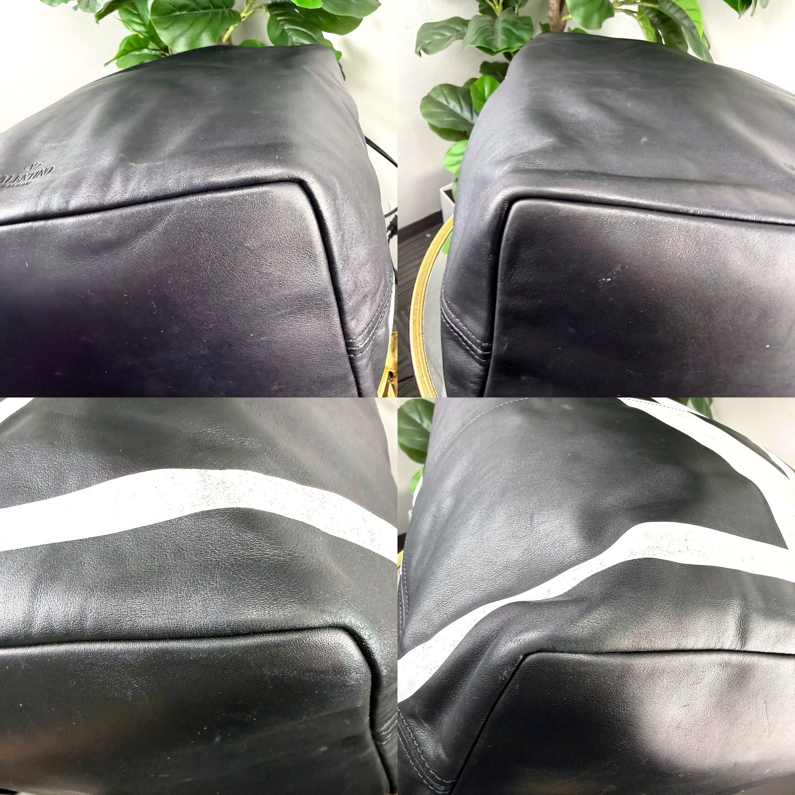 Valentino Garavani VLTN bucket backpack condition detail showing leather scuffing and cracked logo print