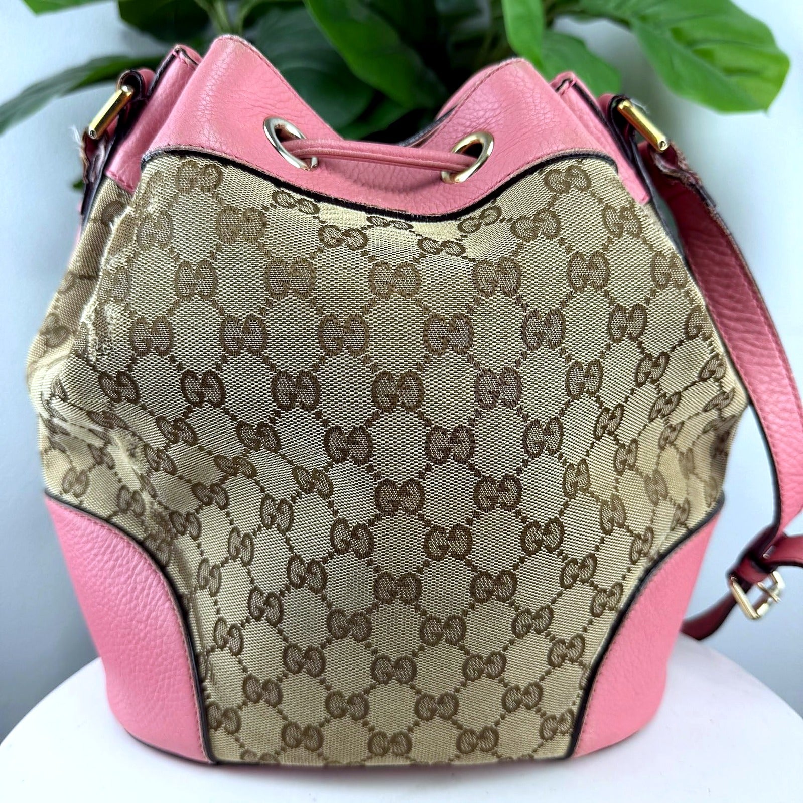 Authentic Gucci GG Monogram Canvas Bucket Bag with Pink Leather Trim - back and side view with strap