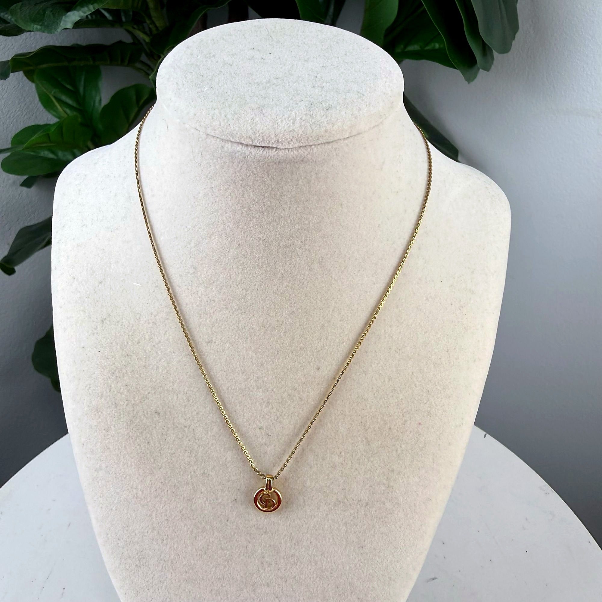 Authentic Gucci Gold-Tone Interlocking GG Pendant Necklace front view on bust