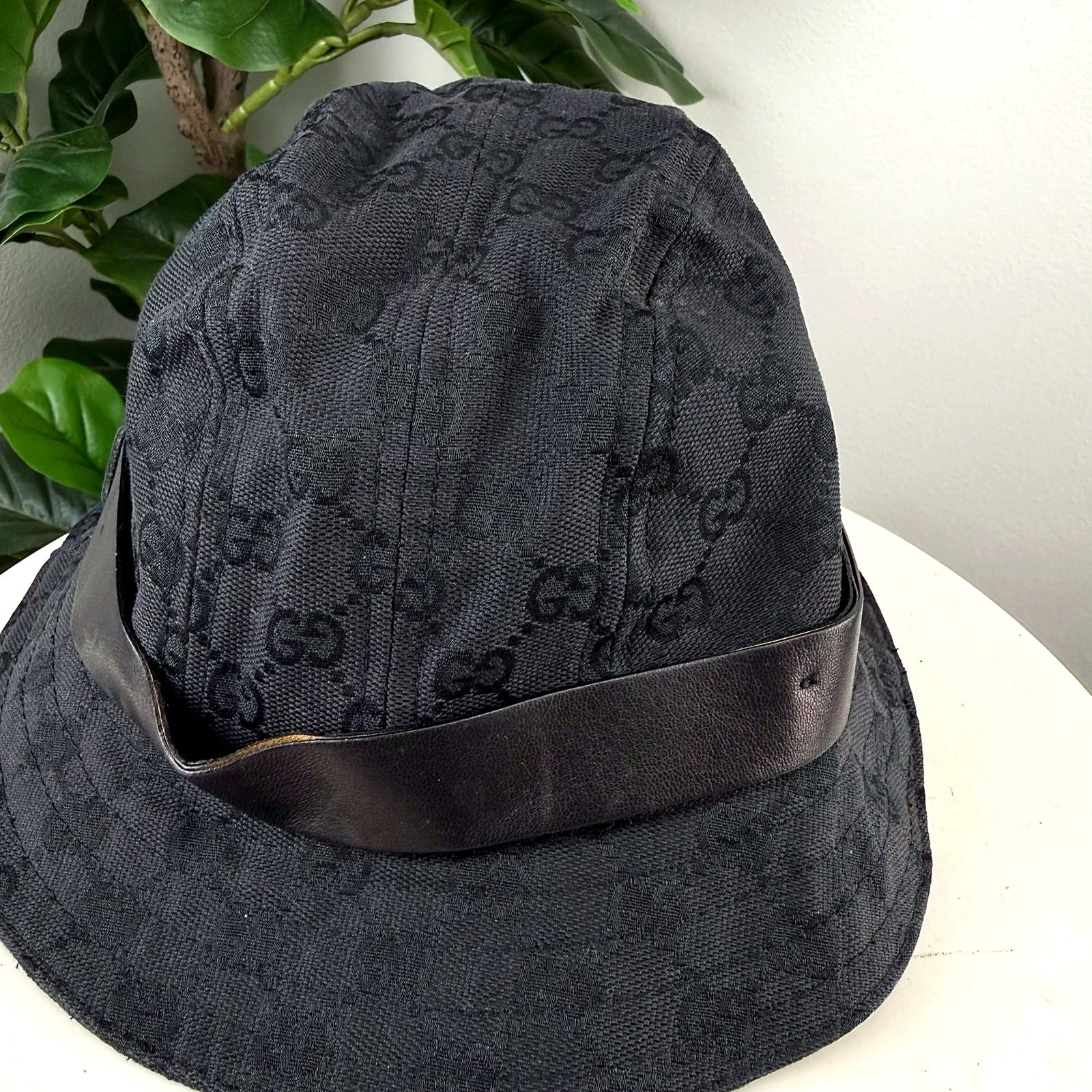 Authentic Gucci Black GG Monogram Canvas Bucket Hat - angle view
