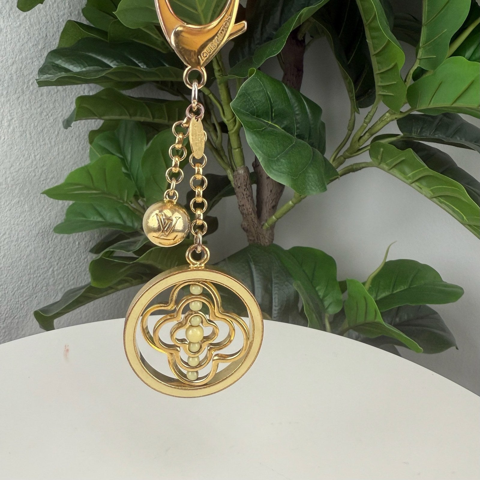 Louis Vuitton monogram flower medallion bag charm - front