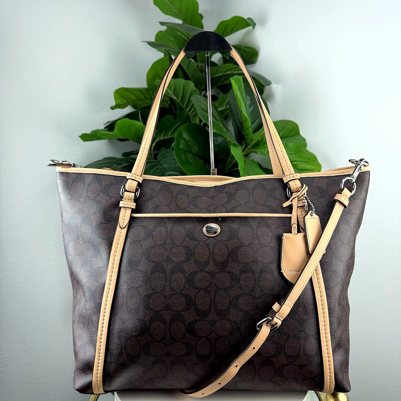 Authentic Coach brown Signature canvas tote bag, front view with camel leather trim and crossbody strap