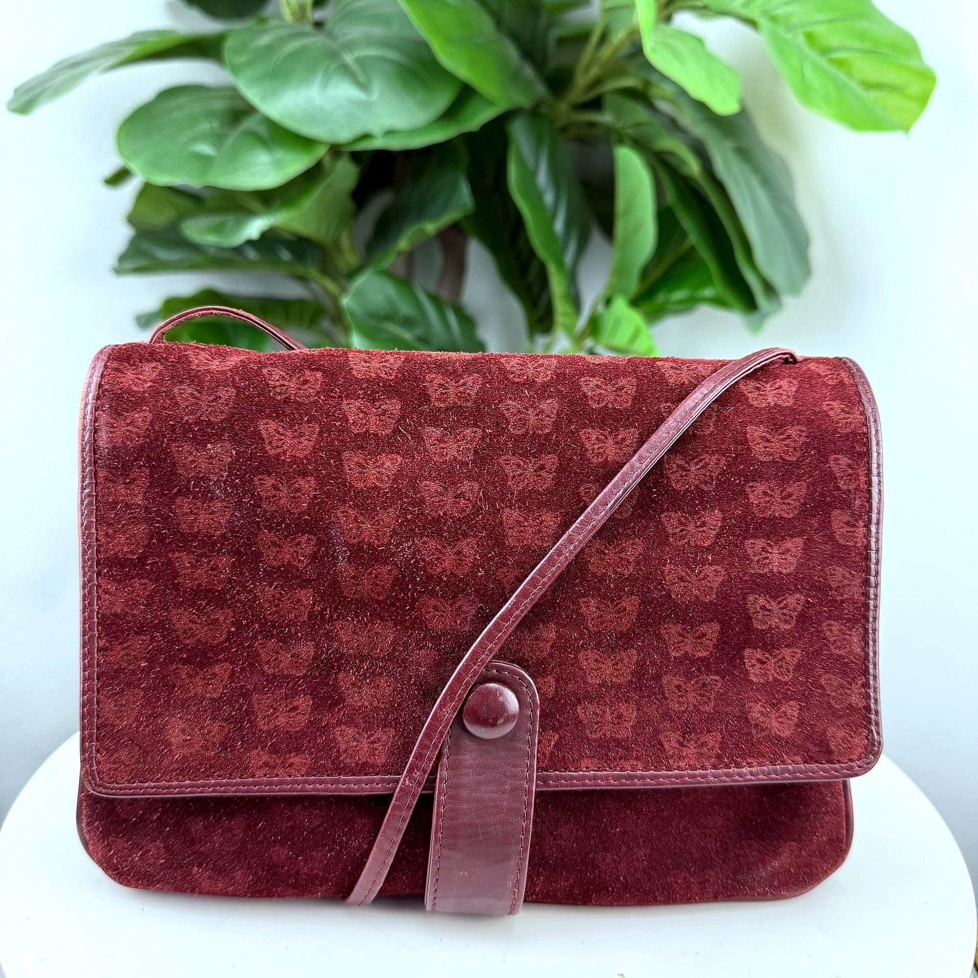 Vintage burgundy suede butterfly embossed crossbody bag, front view