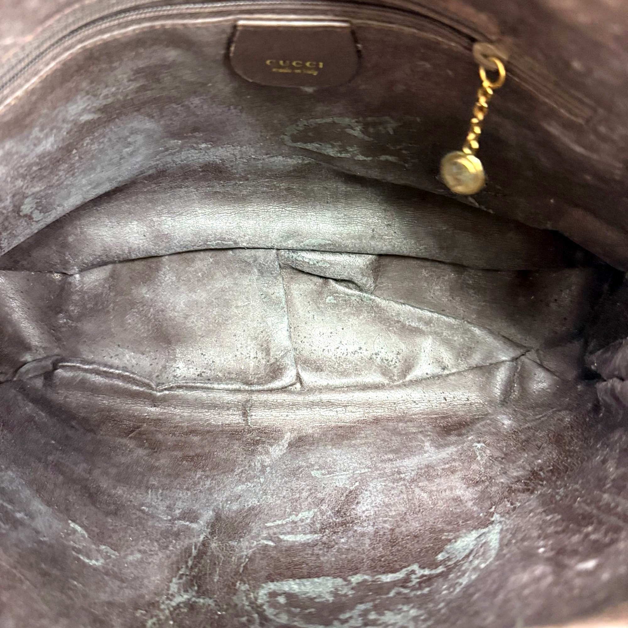 Interior Gucci Made in Italy tag and zipper charm