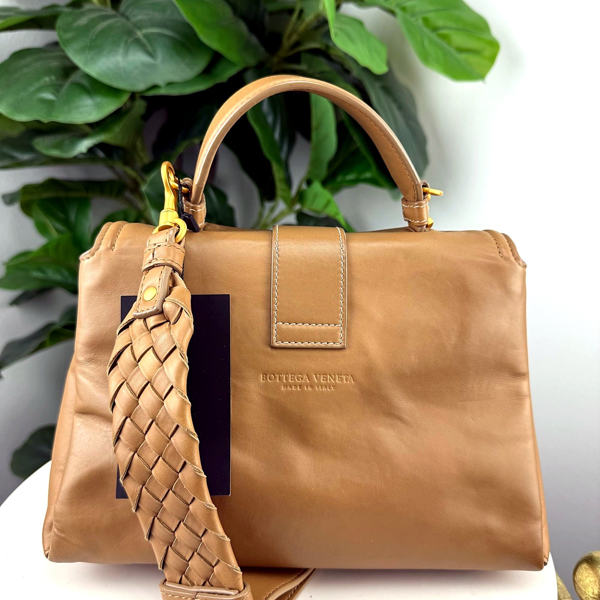 Authentic Bottega Veneta camel leather top handle bag - back view with embossed Bottega Veneta Made in Italy logo