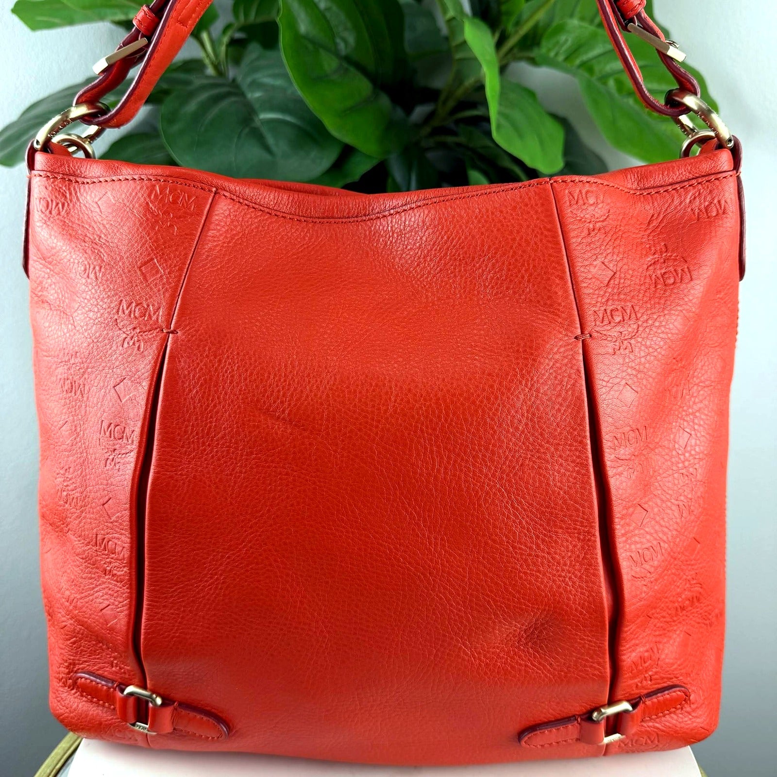 Authentic MCM red embossed monogram pleated hobo bag - back view