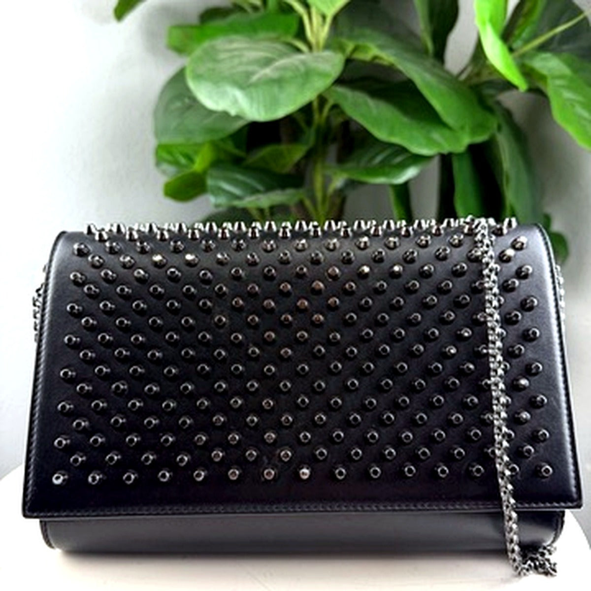 Authentic Christian Louboutin black spike-studded clutch wallet on chain - front