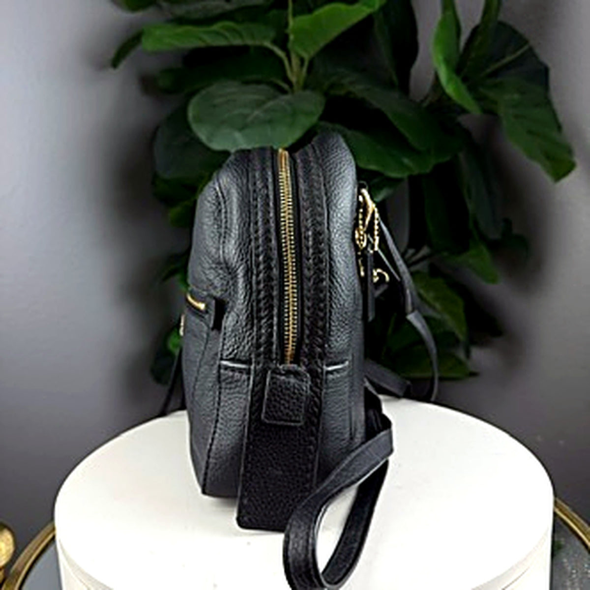 Authentic Coach black pebbled leather mini backpack, side view