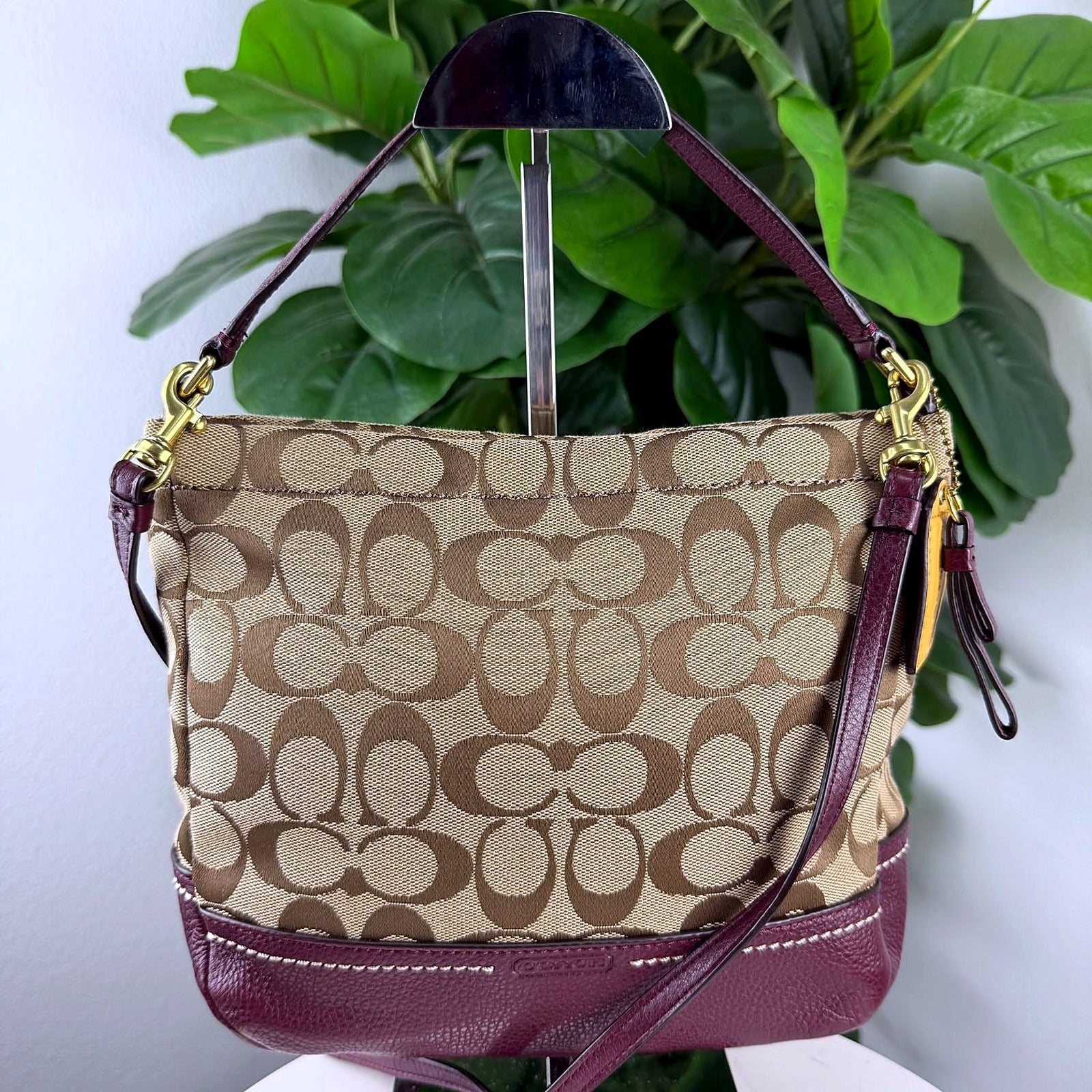 Authentic Coach Tan Signature Canvas Hobo Bag with Plum Leather Trim - front view