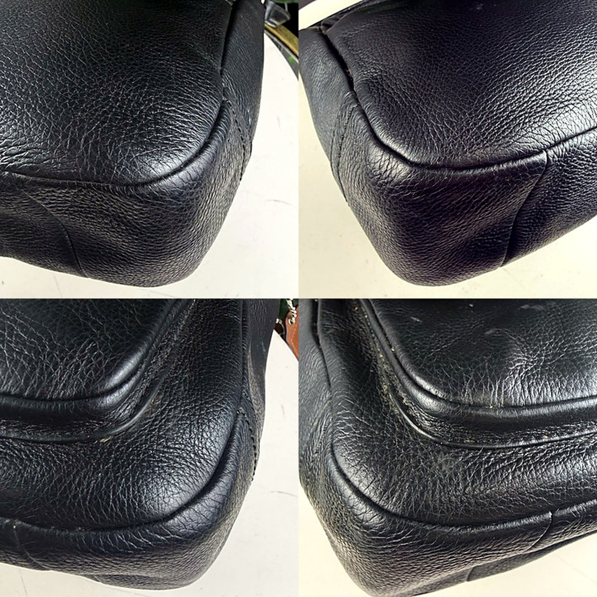Coach crossbody bag corner detail showing light scuffing and marks
