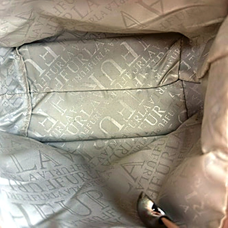 Furla blush tote interior fabric lining with repeating FURLA logo pattern