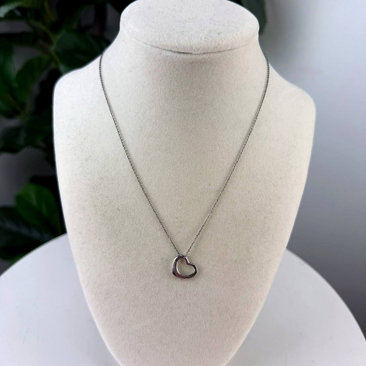 Authentic Tiffany & Co. Elsa Peretti Open Heart sterling silver pendant necklace, front view on bust